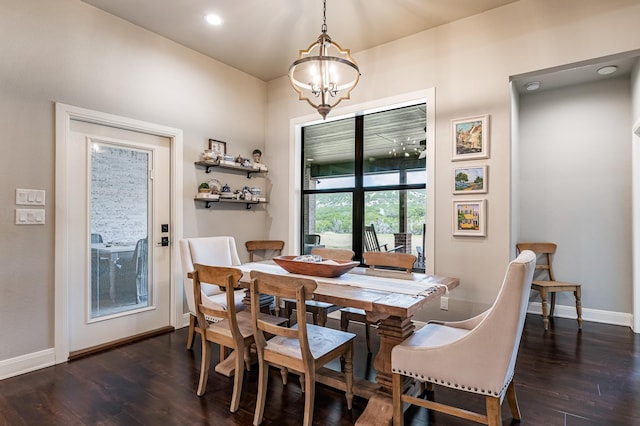 dining space featuring baseboards, dark wood-style flooring, a notable chandelier, and recessed lighting