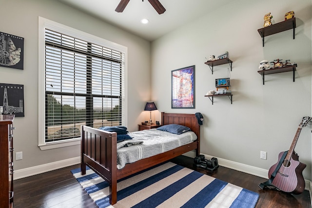 bedroom with recessed lighting, wood finished floors, and baseboards