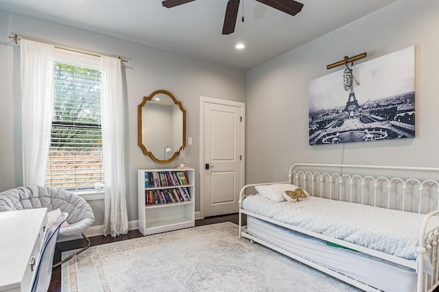 bedroom featuring ceiling fan, recessed lighting, wood finished floors, and baseboards