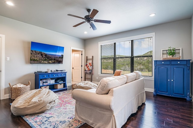 living area featuring recessed lighting, dark wood finished floors, and baseboards