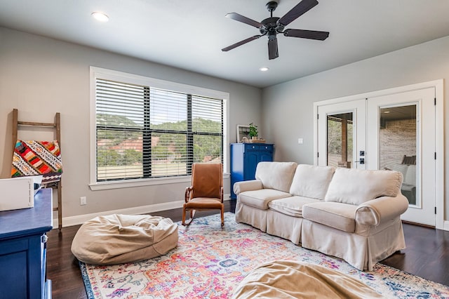 living room featuring recessed lighting, baseboards, dark wood finished floors, and french doors