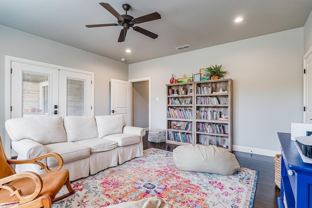 living area with recessed lighting, french doors, visible vents, and wood finished floors