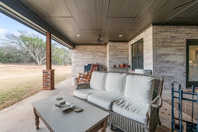 view of patio featuring ceiling fan and outdoor lounge area