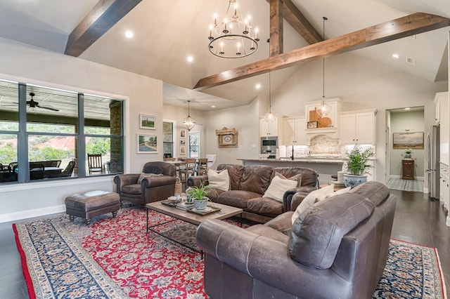 living room with dark wood-style floors, high vaulted ceiling, beamed ceiling, baseboards, and ceiling fan with notable chandelier