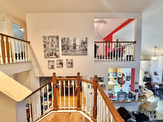 staircase featuring wood finished floors