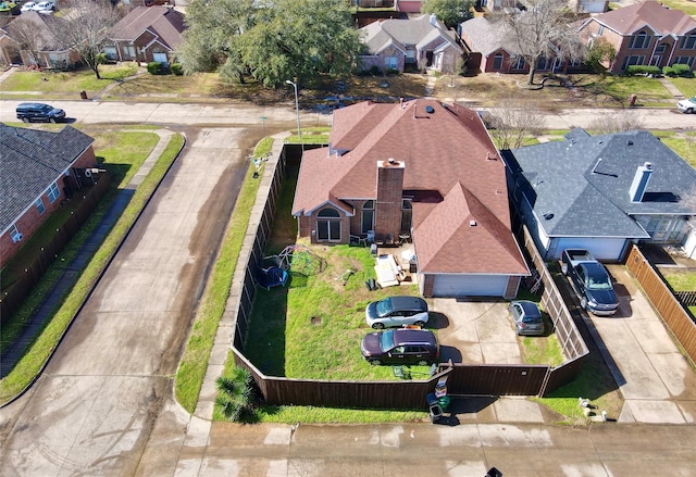 birds eye view of property with a residential view