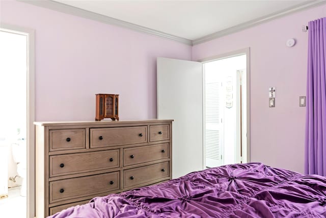 bedroom with crown molding