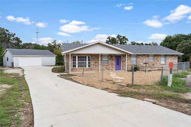 ranch-style house featuring an outbuilding, brick siding, a detached garage, and fence