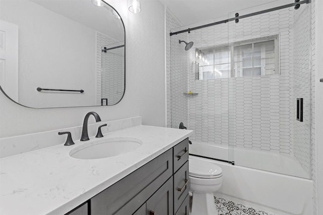 bathroom with toilet, bath / shower combo with glass door, and vanity