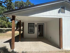 exterior space featuring a carport