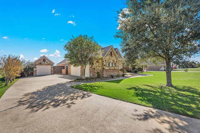 view of front of house featuring stone siding, brick siding, a front yard, and driveway