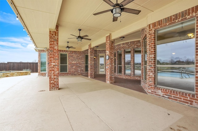 view of patio / terrace featuring ceiling fan and fence