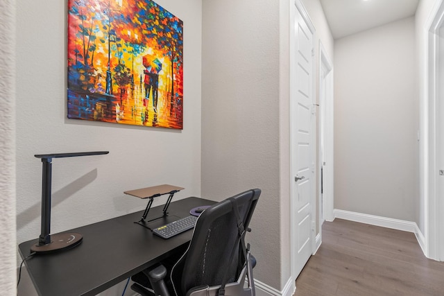 office with baseboards and wood finished floors