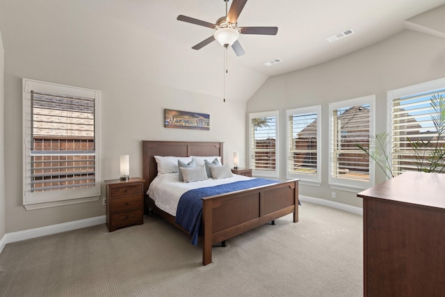 bedroom with baseboards, visible vents, light colored carpet, lofted ceiling, and ceiling fan