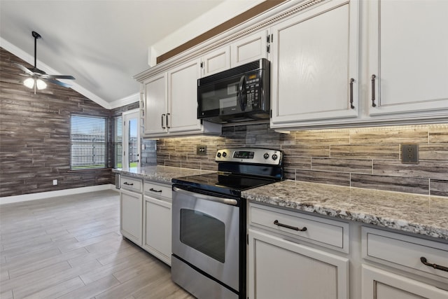 kitchen with black microwave, tasteful backsplash, vaulted ceiling, and stainless steel electric stove