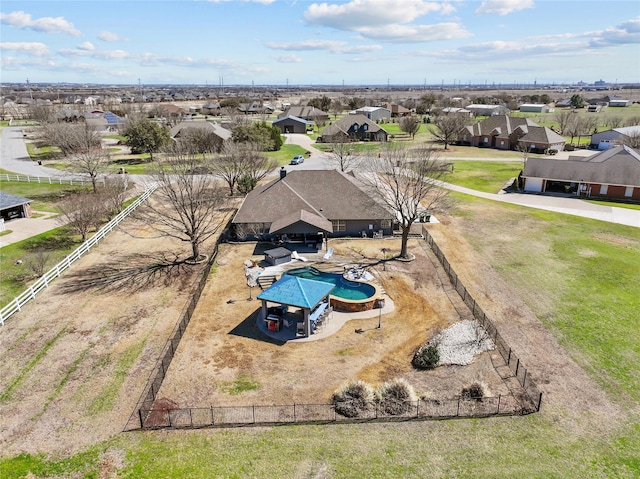 birds eye view of property with a residential view