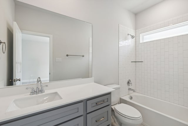 full bath with shower / tub combination, vanity, and toilet