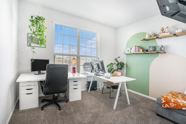 carpeted home office with baseboards