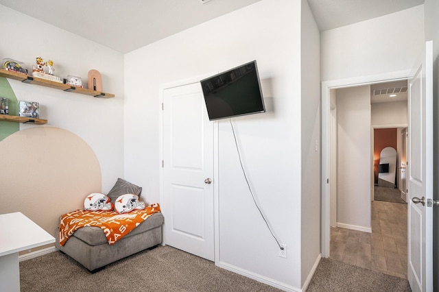 bedroom with carpet flooring and visible vents