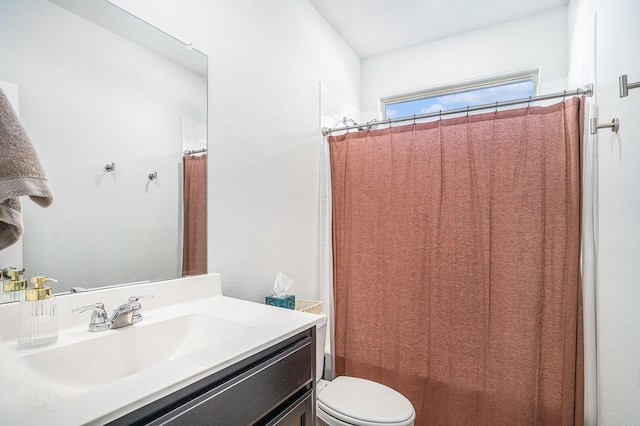 full bathroom with shower / bath combo, vanity, and toilet