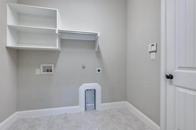 laundry area with laundry area, baseboards, hookup for a gas dryer, hookup for an electric dryer, and washer hookup