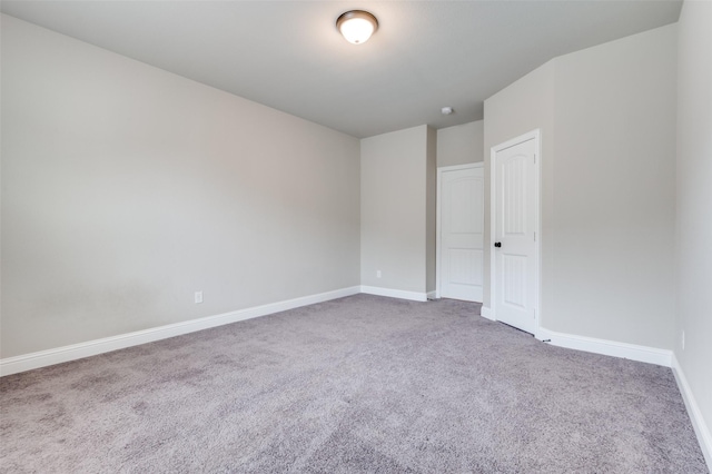 unfurnished bedroom with carpet floors and baseboards