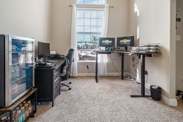 office space with carpet and baseboards