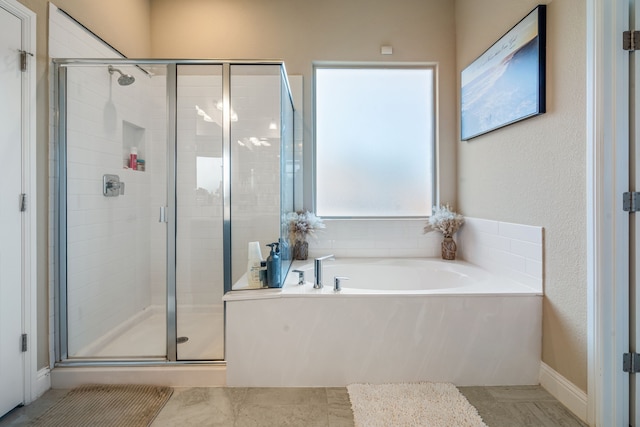 full bath featuring a stall shower and a bath