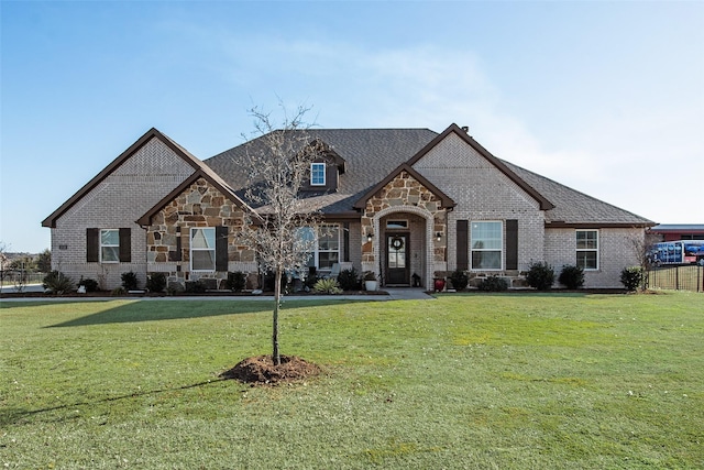 1016 Northern Oaks Ct, Springtown, TX 76082 - french country inspired facade featuring stone siding, brick siding, and a shingled roof