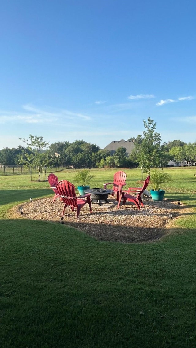 1016 Northern Oaks Ct, Springtown, TX 76082 - view of green lawn featuring a fire pit