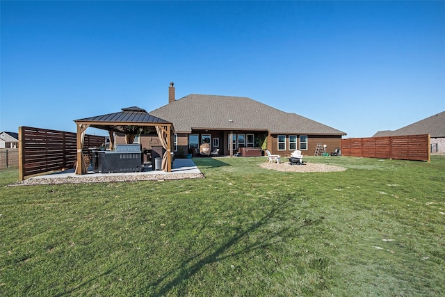 1016 Northern Oaks Ct, Springtown, TX 76082 - rear view of house with a hot tub, a gazebo, a patio area, and a chimney
