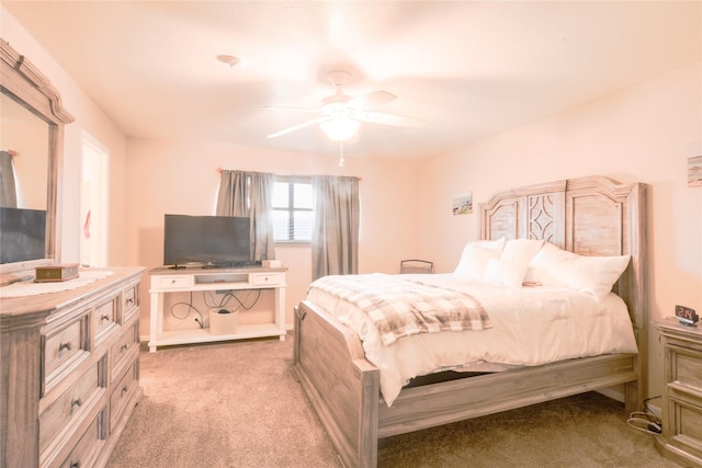 bedroom with light carpet and ceiling fan