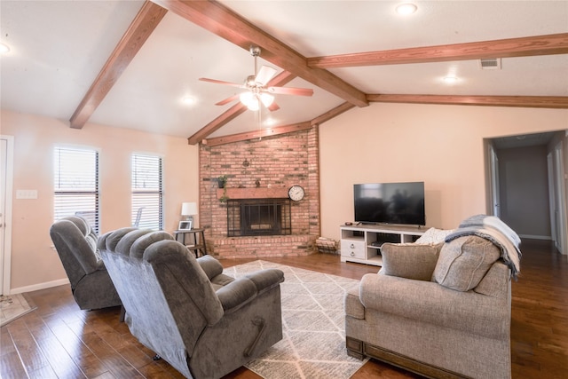 living room featuring vaulted ceiling with beams, a fireplace, visible vents, wood finished floors, and baseboards