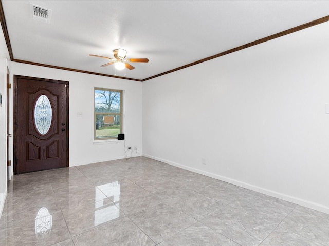 foyer featuring baseboards, ceiling fan, visible vents, and crown molding