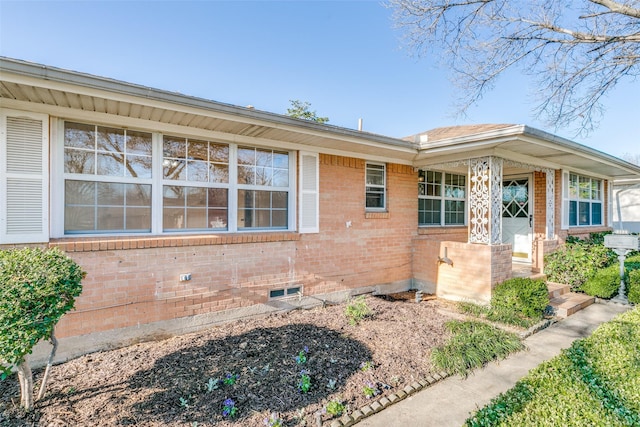 exterior space with brick siding