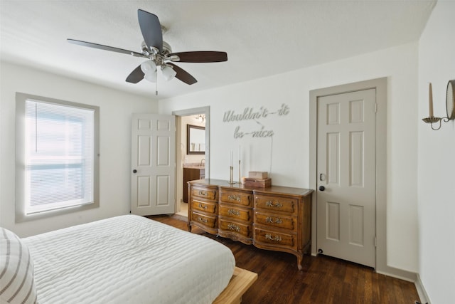 bedroom with dark wood-style floors, ceiling fan, and baseboards