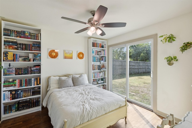 bedroom with access to outside, a ceiling fan, and wood finished floors