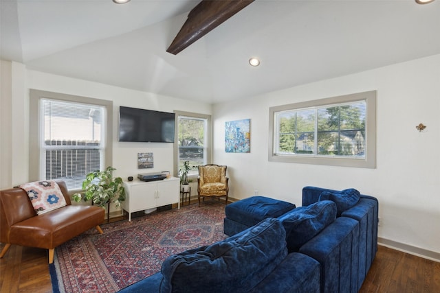 living room with a wealth of natural light, lofted ceiling with beams, baseboards, and wood finished floors