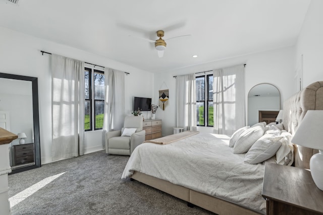 carpeted bedroom with ceiling fan and visible vents