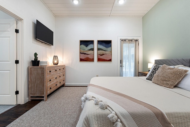 bedroom featuring wood finished floors and baseboards