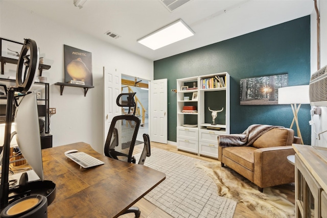 office featuring light wood-style flooring and visible vents