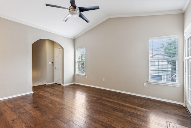 empty room featuring ornamental molding, vaulted ceiling, and hardwood / wood-style floors