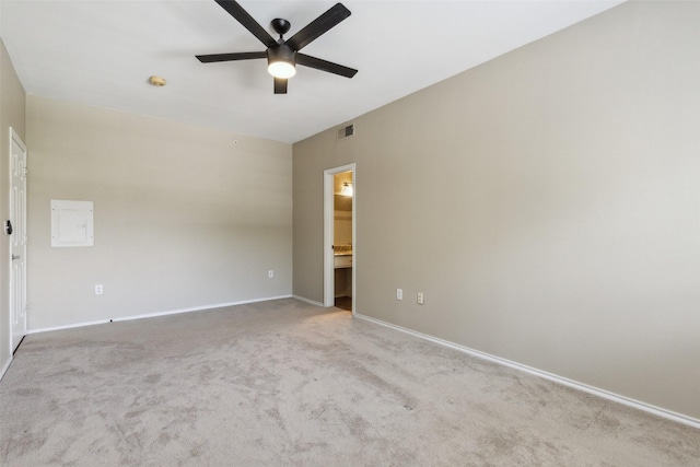 unfurnished room with carpet floors, visible vents, ceiling fan, and baseboards