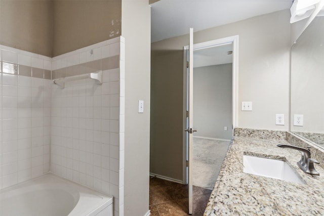 full bathroom featuring bathing tub / shower combination, baseboards, and vanity