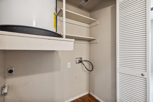 washroom with hookup for an electric dryer, washer hookup, wood finished floors, visible vents, and baseboards