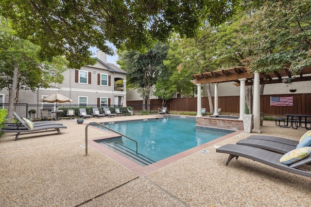 pool featuring fence, a pergola, and a patio