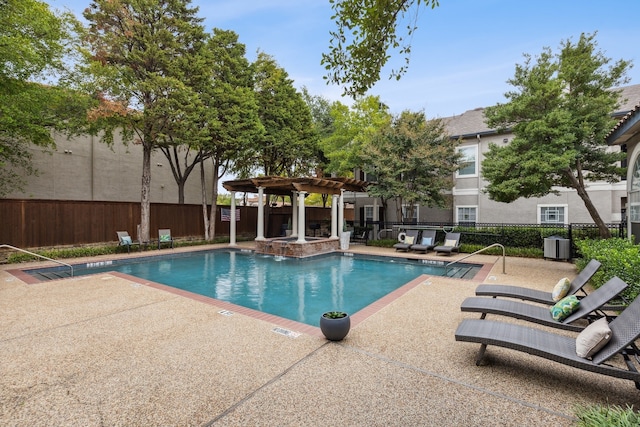 pool featuring a community hot tub, a patio area, fence, and a pergola