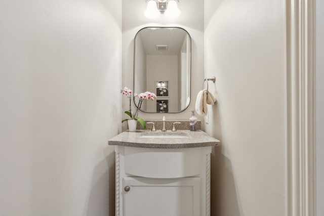 bathroom with visible vents and vanity