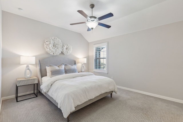 bedroom featuring light carpet, ceiling fan, baseboards, and vaulted ceiling