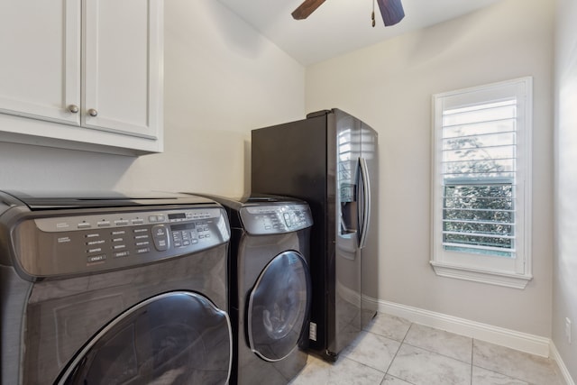 washroom with light tile patterned floors, baseboards, cabinet space, ceiling fan, and independent washer and dryer